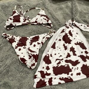 Cow print two piece bathing suit and cover up